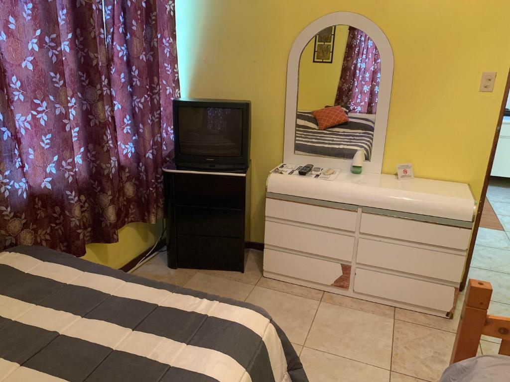 Postel nebo postele na pokoji v ubytování Rincon Boricua Apartments