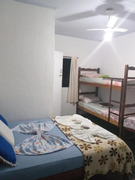 Postel nebo postele na pokoji v ubytování Pousada da Helena Trindade