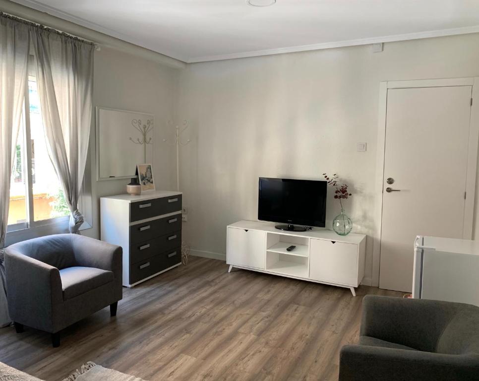 TV a/nebo společenská místnost v ubytování Slow Room Valencia