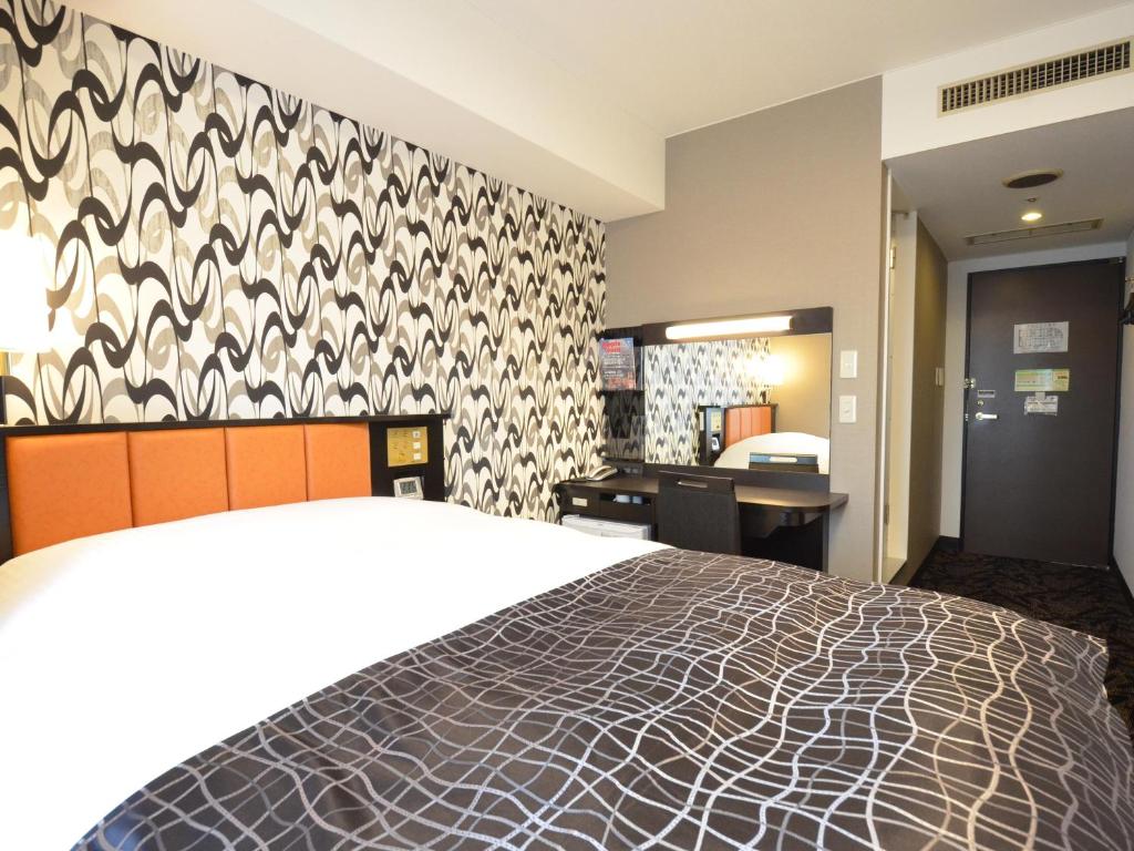 Postel nebo postele na pokoji v ubytování APA Hotel Biwako Seta Ekimae