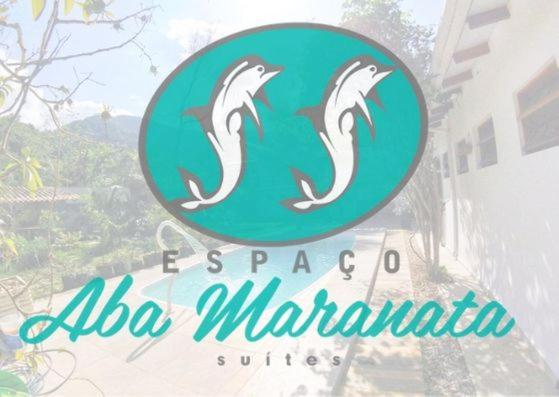 a sign for a zoo marina with dolphins on it at Espaço Aba Maranata in Ubatuba
