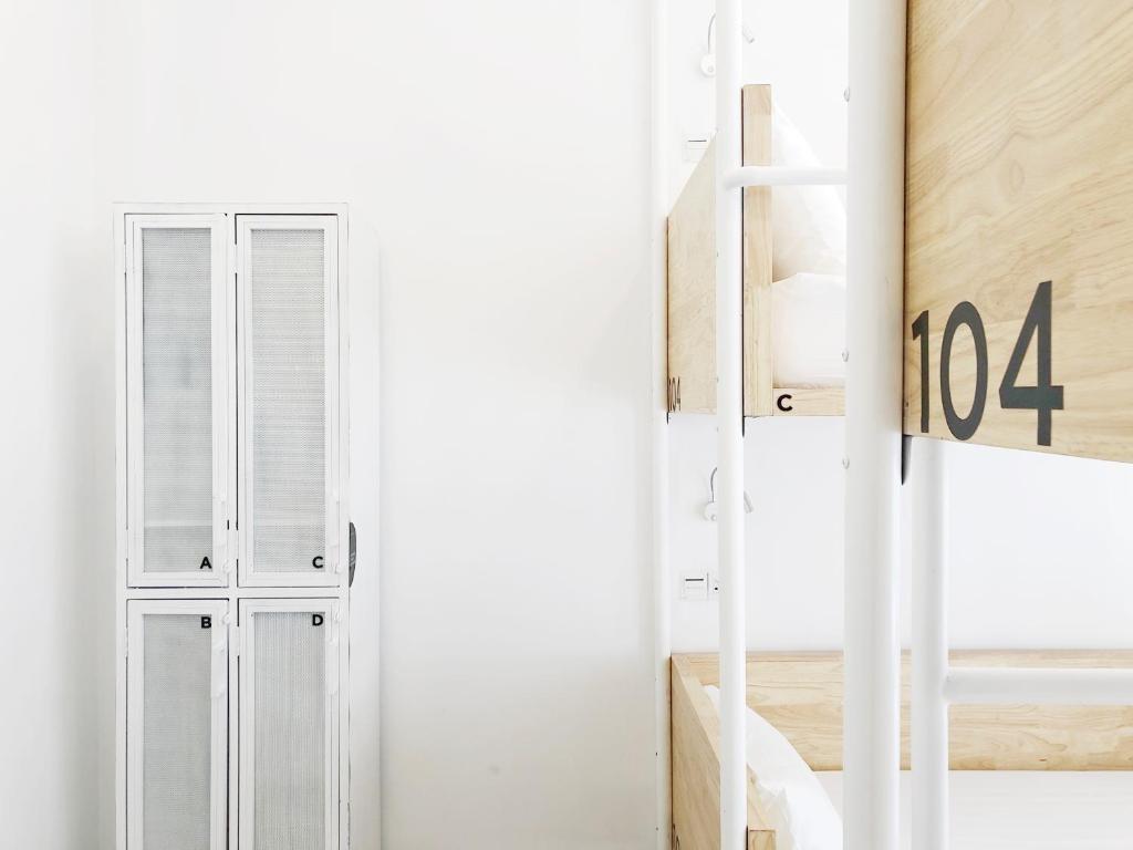 Postel nebo postele na pokoji v ubytování HOOD Hostel
