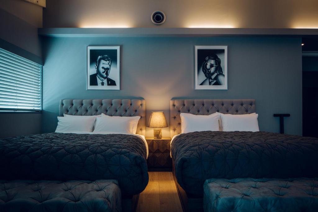Postel nebo postele na pokoji v ubytování node hotel