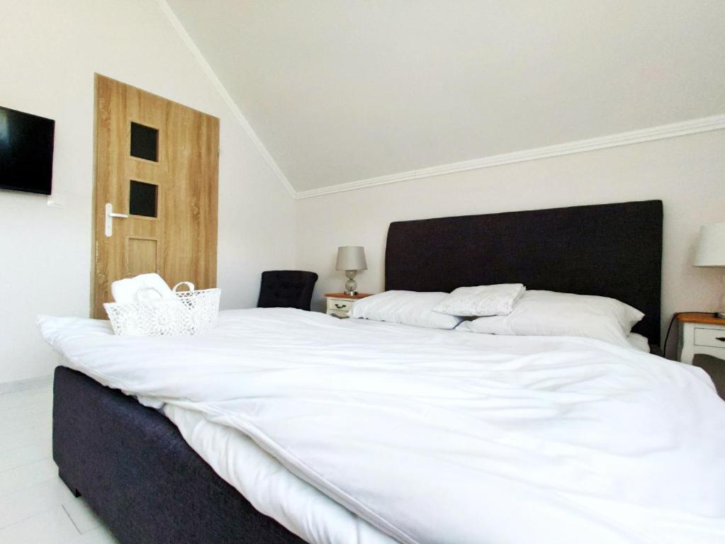 Posteľ alebo postele v izbe v ubytovaní B&B Źródlana 46