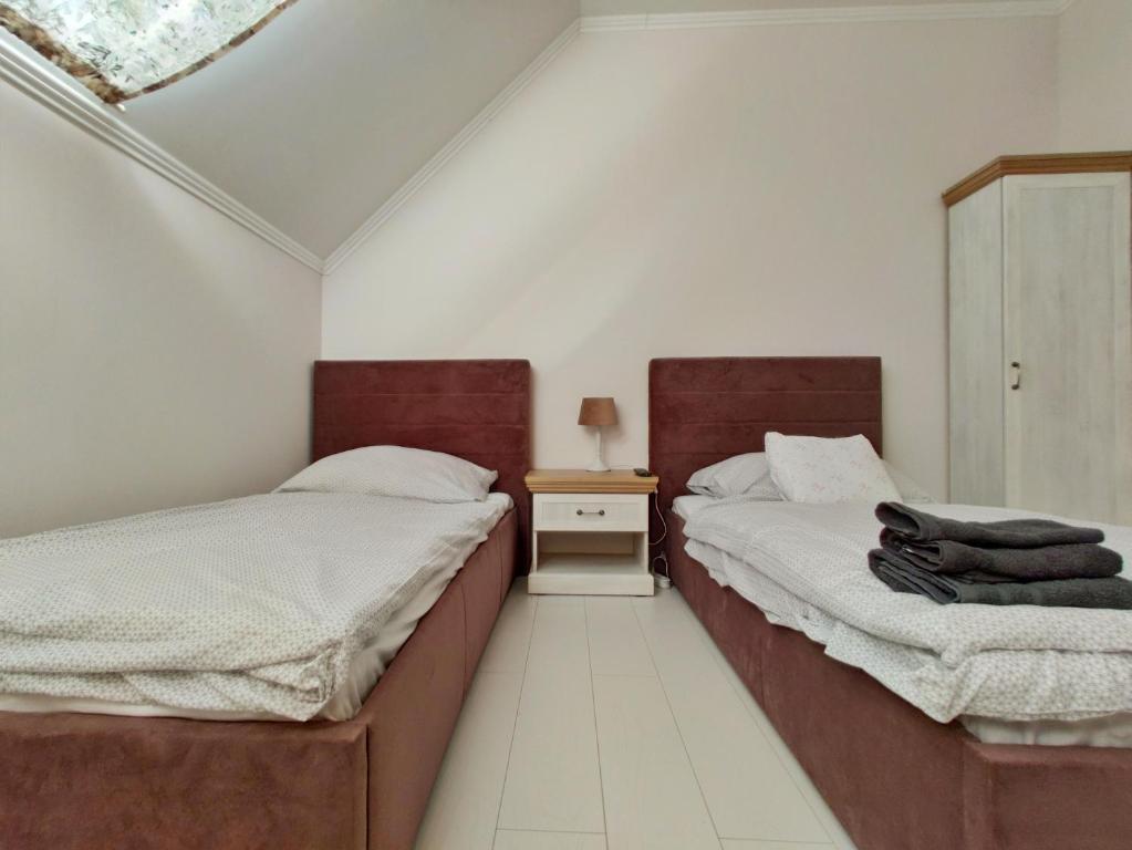 Posteľ alebo postele v izbe v ubytovaní B&B Źródlana 46