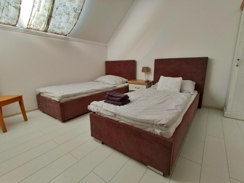 Posteľ alebo postele v izbe v ubytovaní B&B Źródlana 46