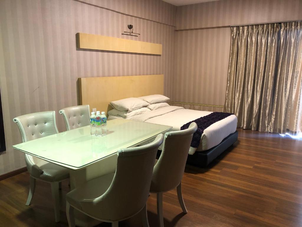 Postel nebo postele na pokoji v ubytování Pariss Hotel