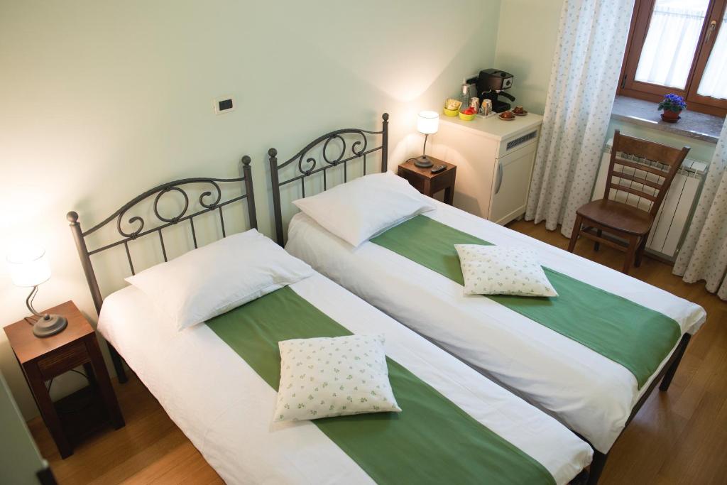 Postel nebo postele na pokoji v ubytování Guesthouse Muha