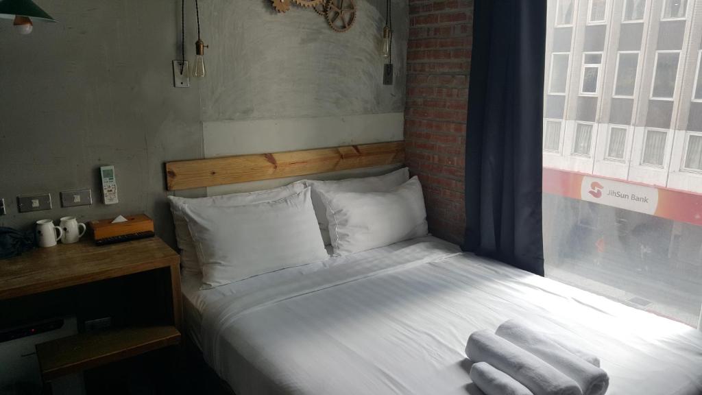 Postel nebo postele na pokoji v ubytování Just Inn 正旅館 台北車站