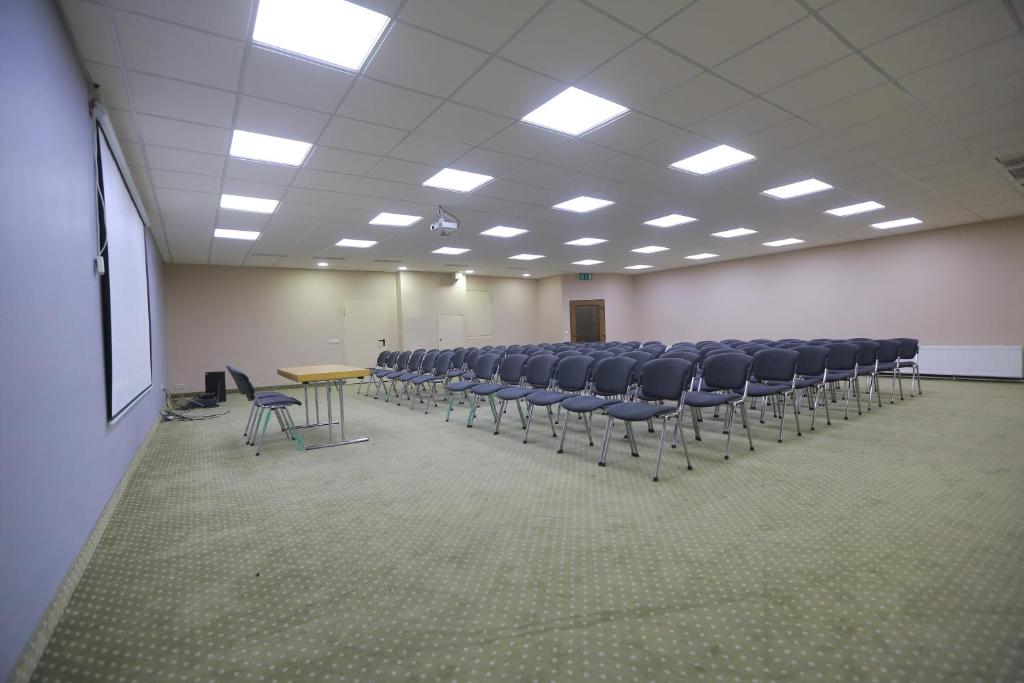 a conference room with chairs and a table in it at Shodlik Palace in Tashkent