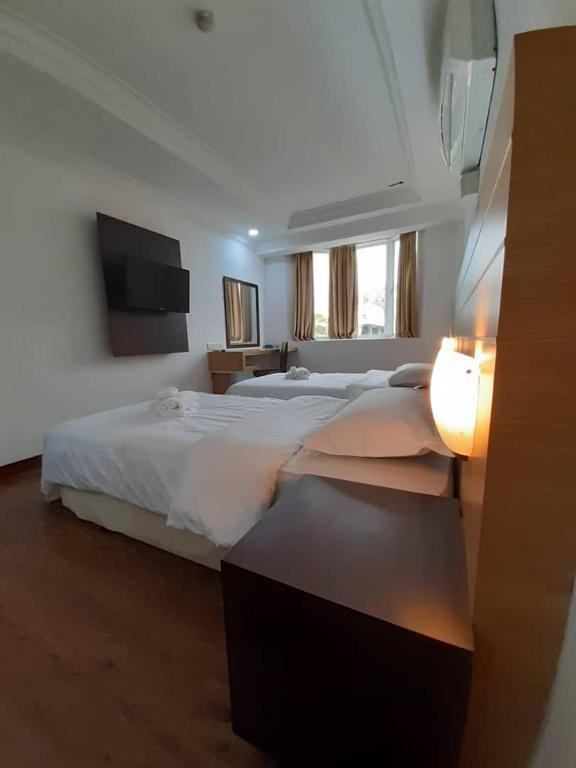Postel nebo postele na pokoji v ubytování Sara Hotel