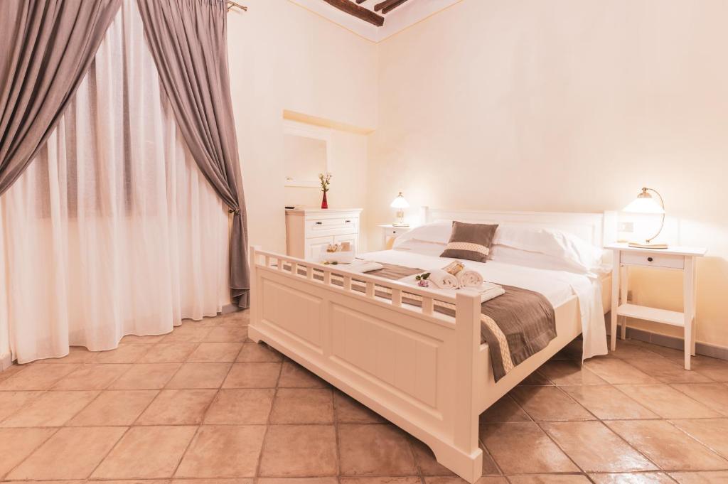 Postel nebo postele na pokoji v ubytování Albergo Giardino
