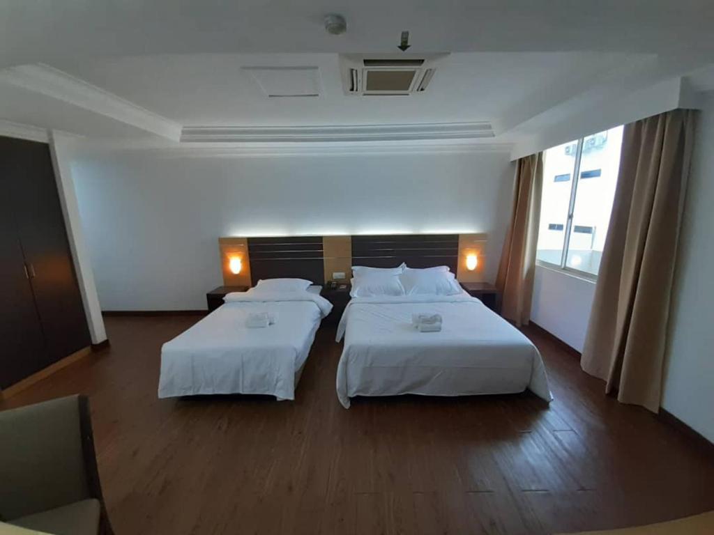 Postel nebo postele na pokoji v ubytování Sara Hotel