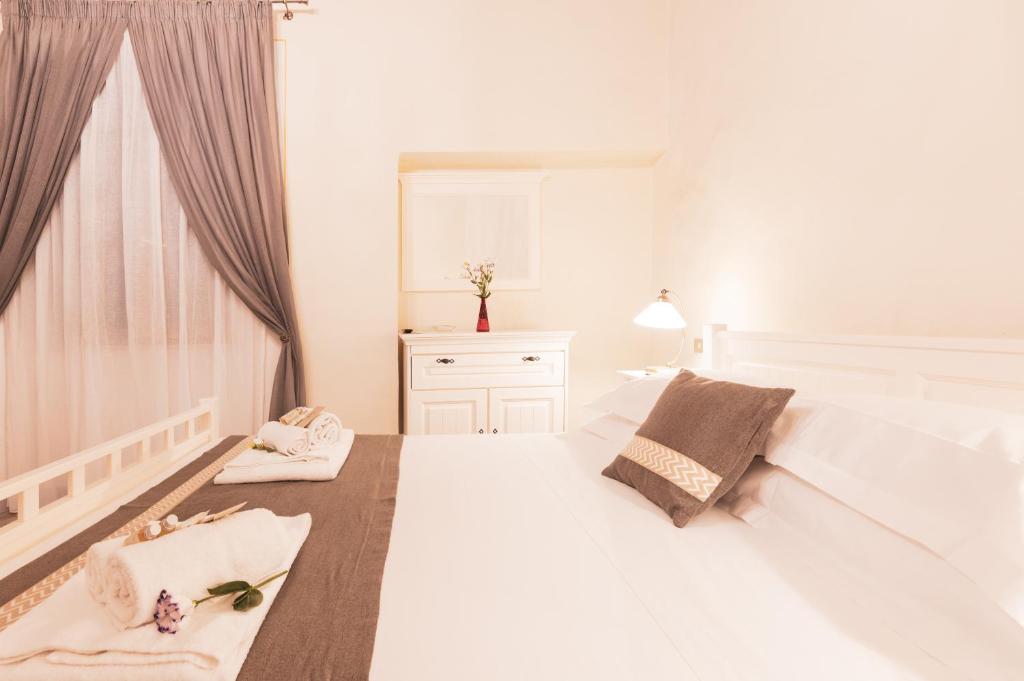 Postel nebo postele na pokoji v ubytování Albergo Giardino