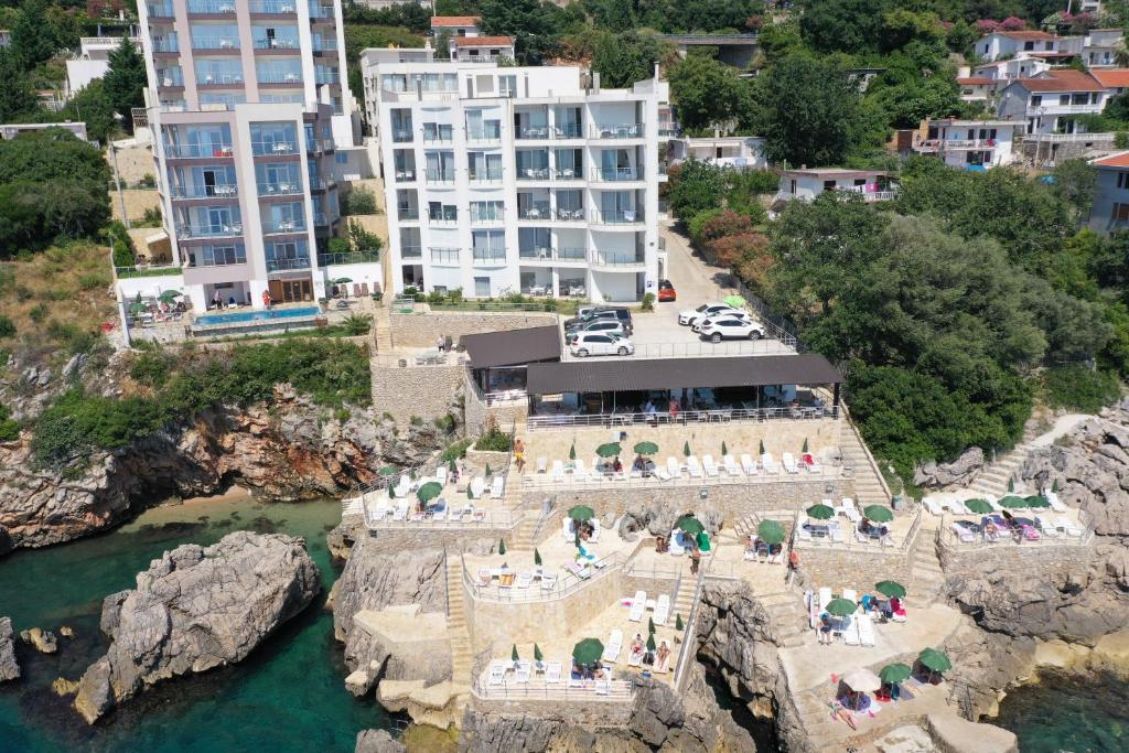 an aerial view of a hotel on a cliff near the water at First line of the sea 1 in Dobra Voda