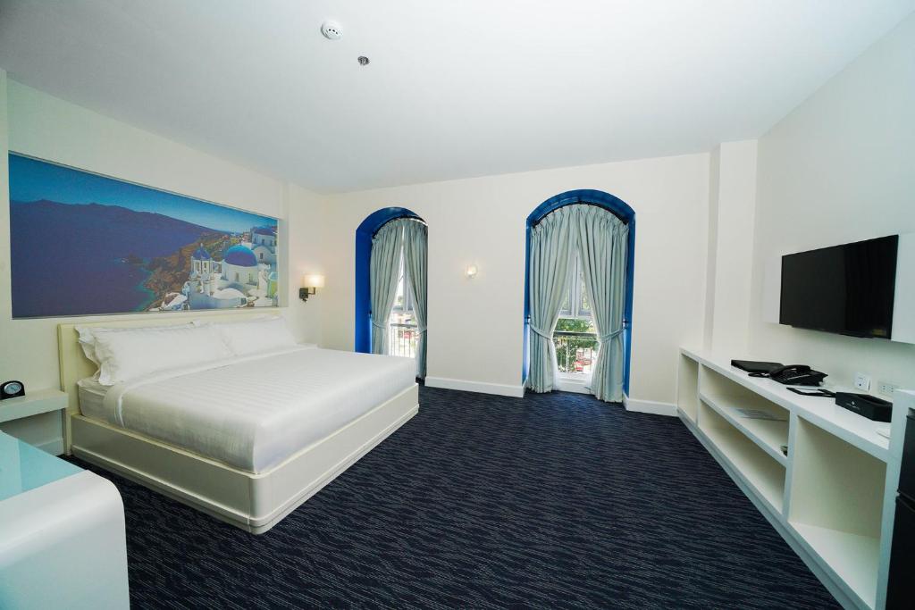 Postel nebo postele na pokoji v ubytování Hotel Carlito Tagaytay