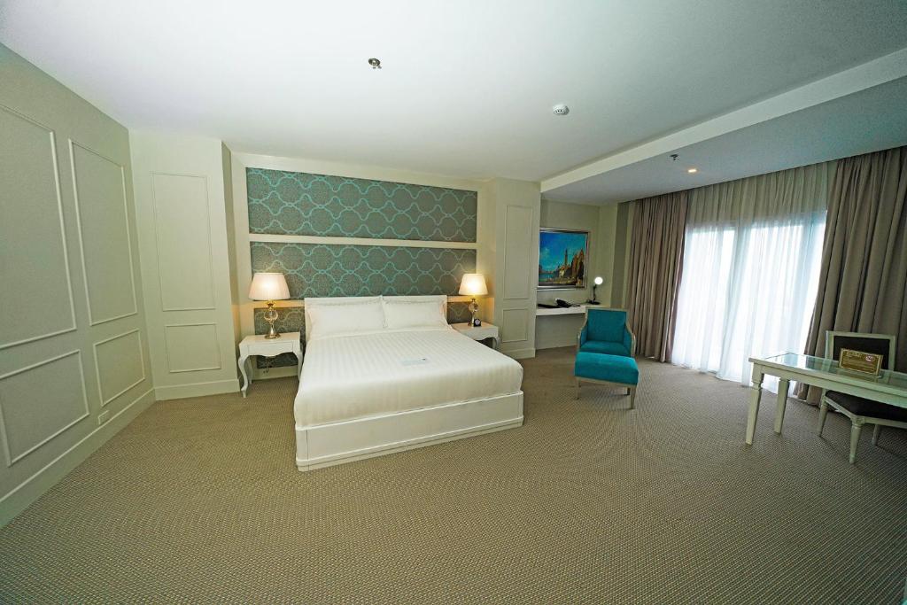 Postel nebo postele na pokoji v ubytování Hotel Carlito Tagaytay