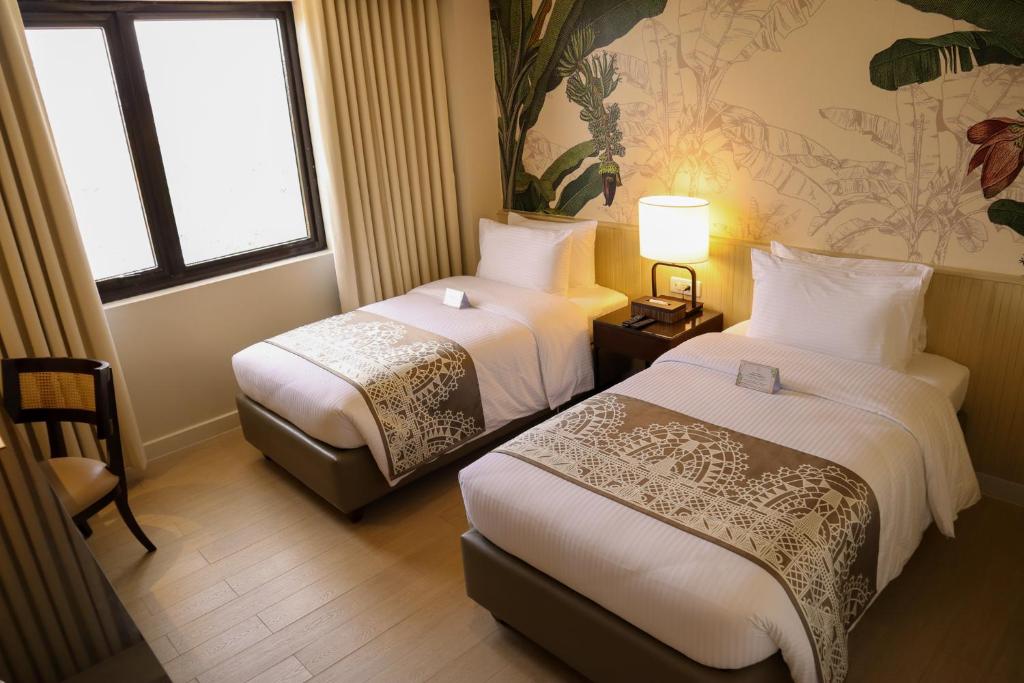 Postel nebo postele na pokoji v ubytování Mella Hotel
