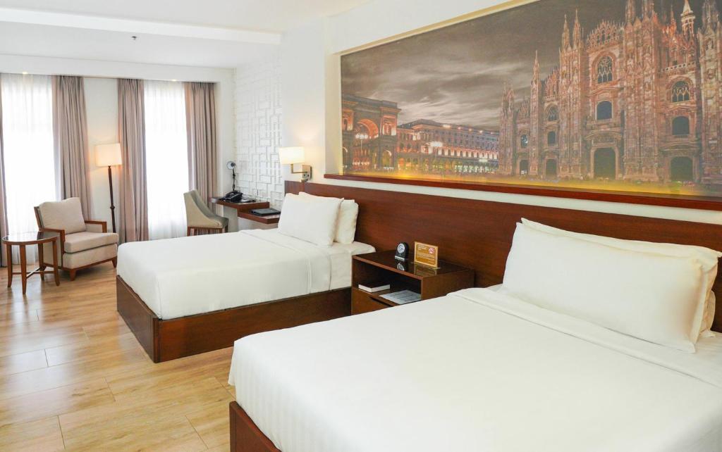 Postel nebo postele na pokoji v ubytování Hotel Carlito Tagaytay