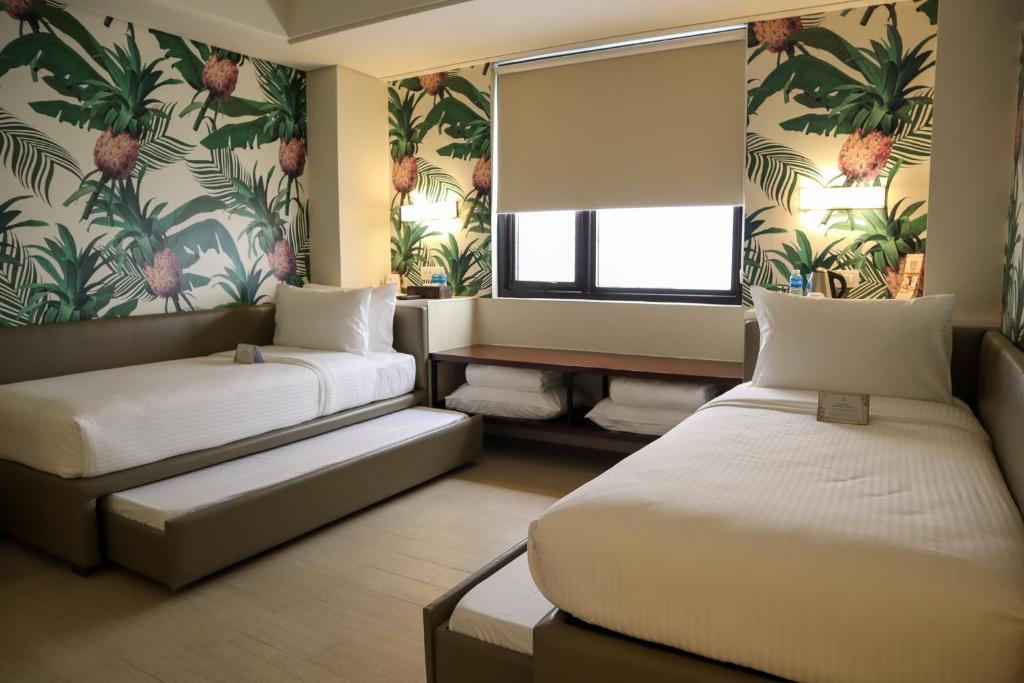 Postel nebo postele na pokoji v ubytování Mella Hotel