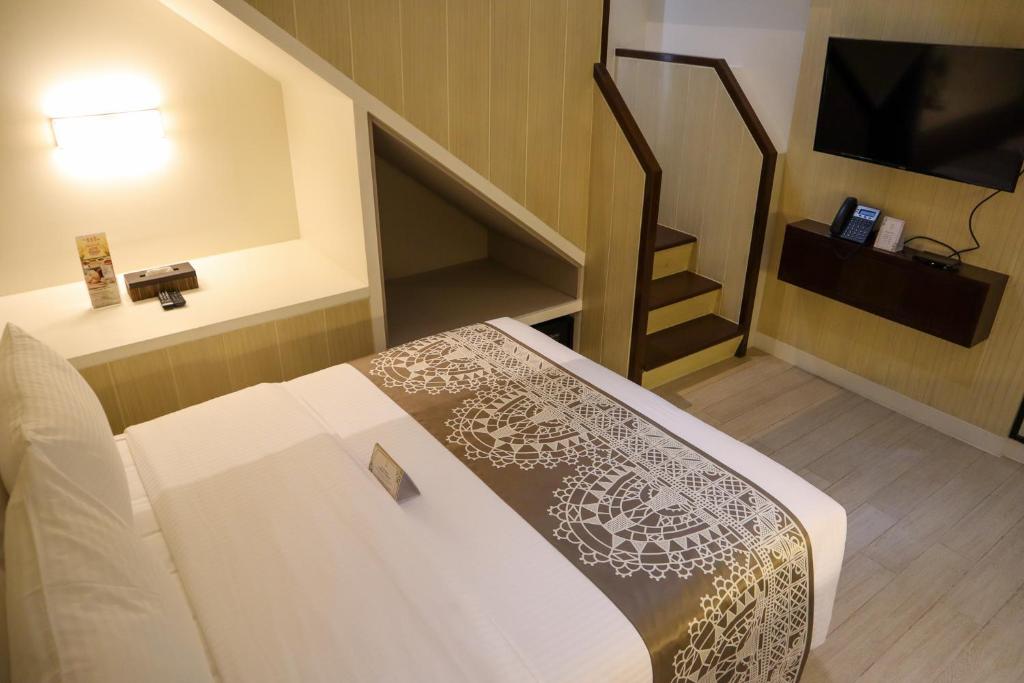 Postel nebo postele na pokoji v ubytování Mella Hotel