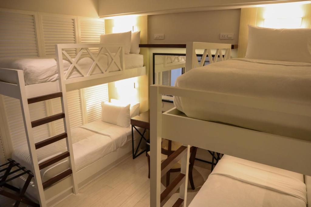 Postel nebo postele na pokoji v ubytování Mella Hotel