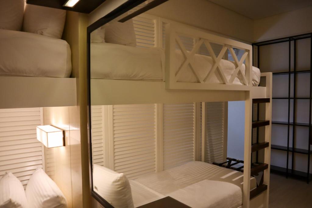 Postel nebo postele na pokoji v ubytování Mella Hotel