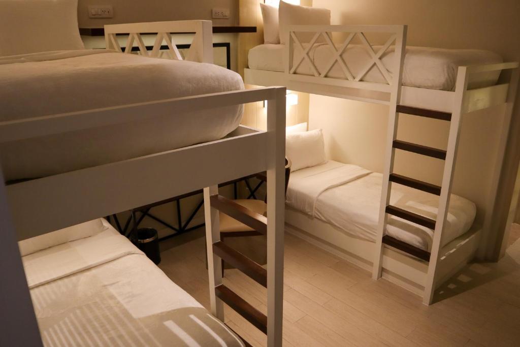 Postel nebo postele na pokoji v ubytování Mella Hotel