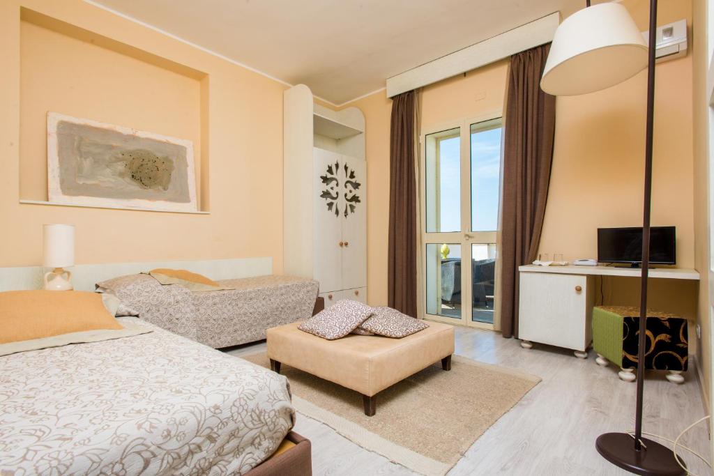 Postel nebo postele na pokoji v ubytování Approdo Boutique Hotel Leuca
