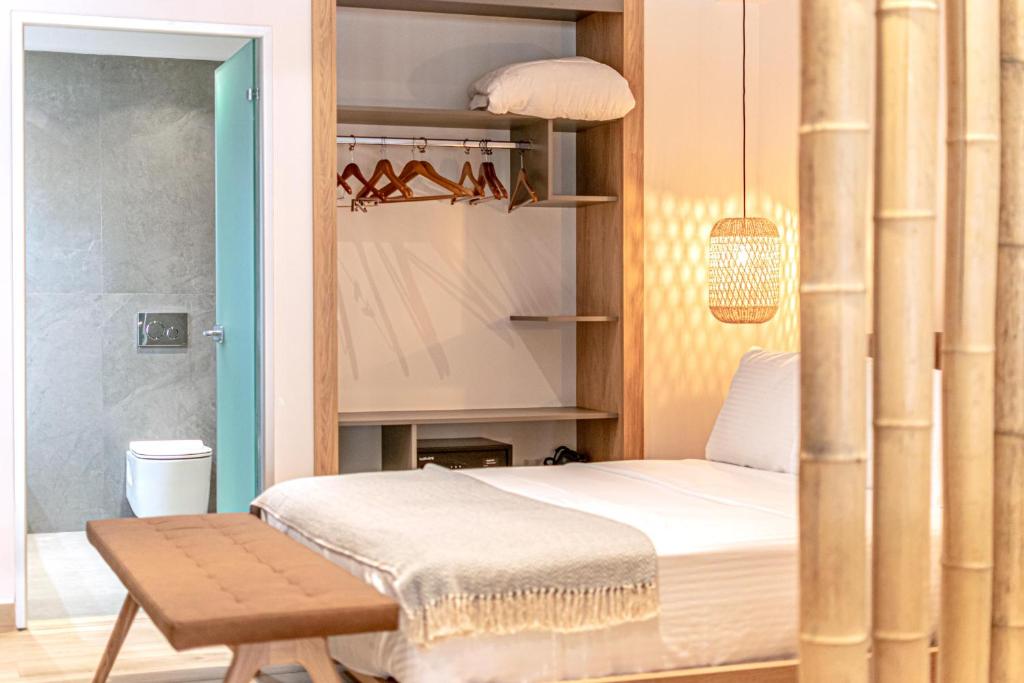 Postel nebo postele na pokoji v ubytování F & S LOUNGE SUITES