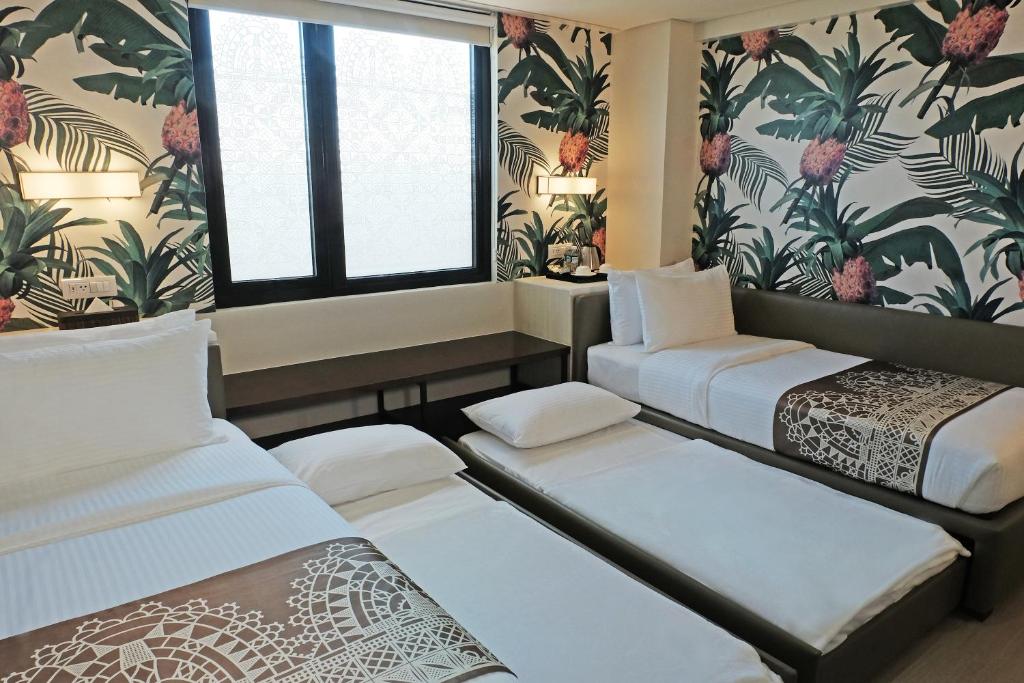 Postel nebo postele na pokoji v ubytování Mella Hotel