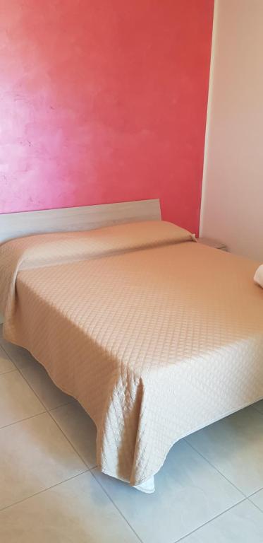 A bed or beds in a room at Le Quattro Rose