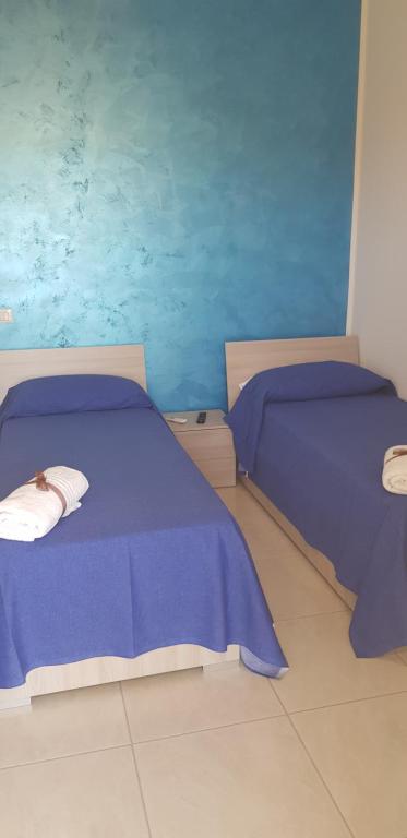 A bed or beds in a room at Le Quattro Rose