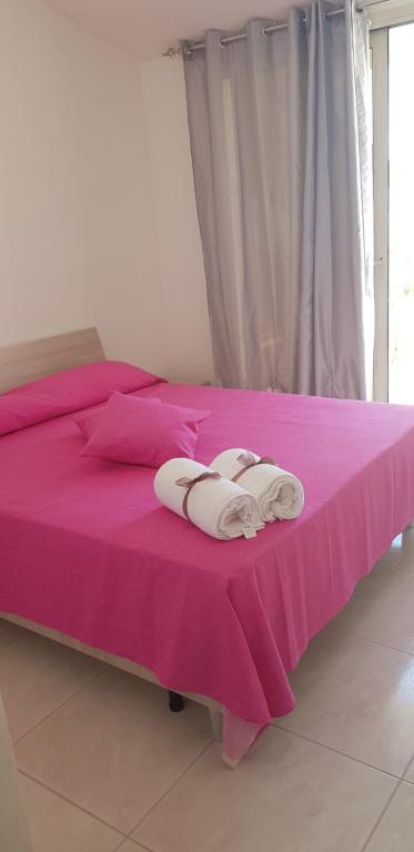A bed or beds in a room at Le Quattro Rose