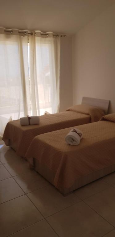 A bed or beds in a room at Le Quattro Rose