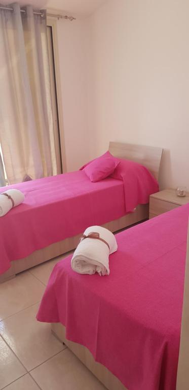 A bed or beds in a room at Le Quattro Rose