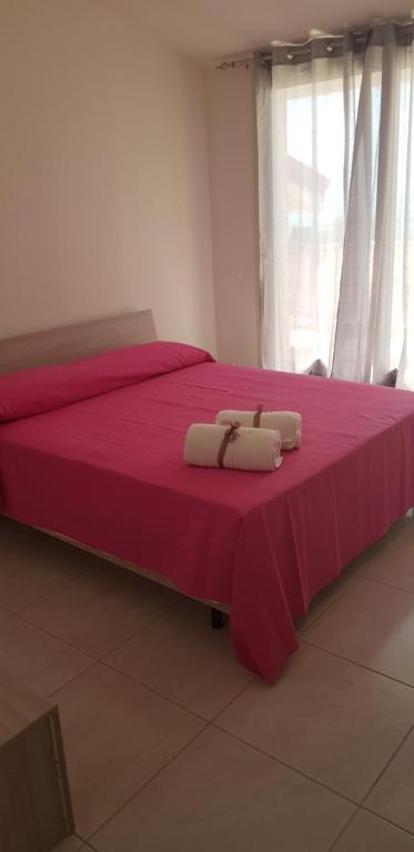 A bed or beds in a room at Le Quattro Rose