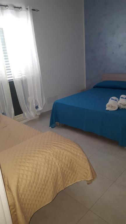A bed or beds in a room at Le Quattro Rose
