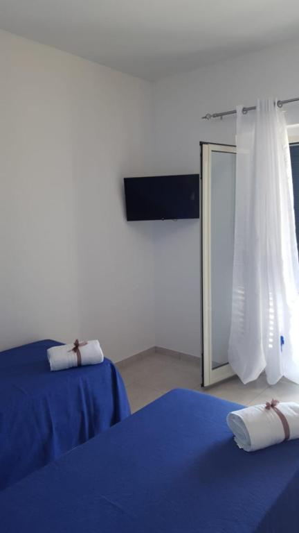 A bed or beds in a room at Le Quattro Rose