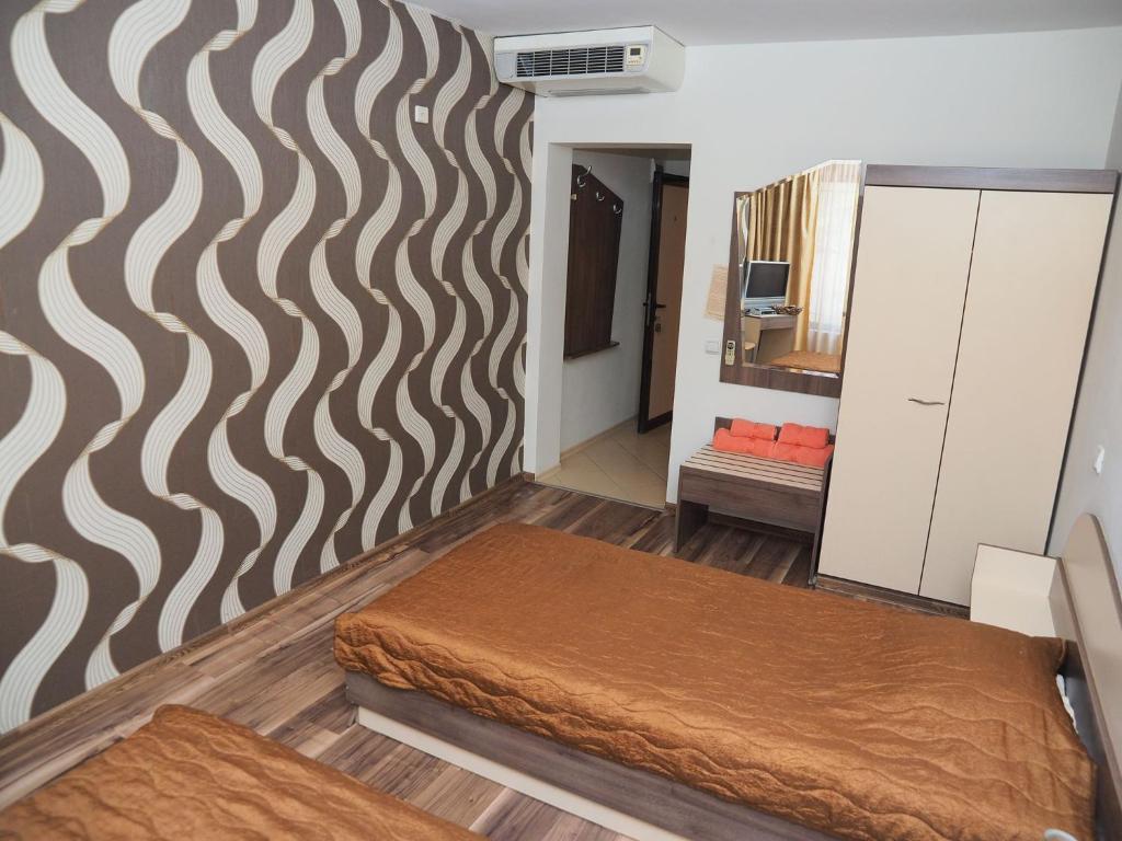 Postel nebo postele na pokoji v ubytování Eos Hotel