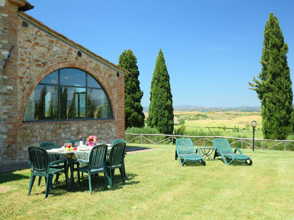 a table and chairs on the grass in a yard at Holiday Home Capanna by Interhome in Casetta