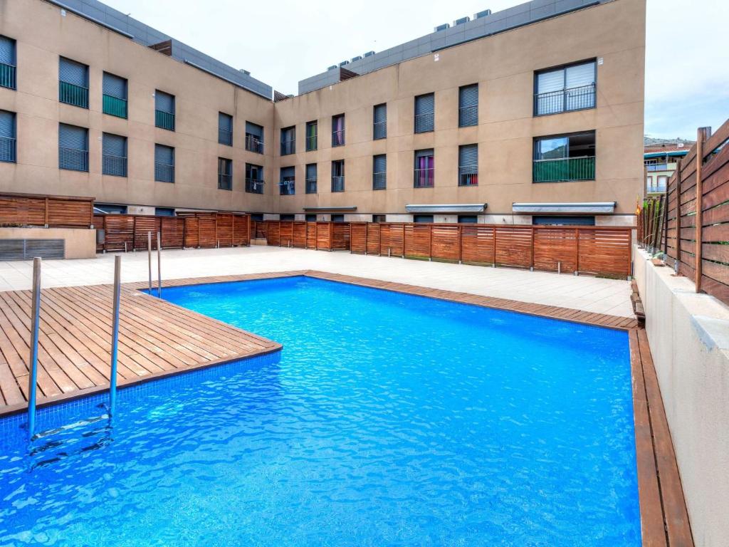 una piscina frente a un edificio en Apartment Escorxador by Interhome, en Colera