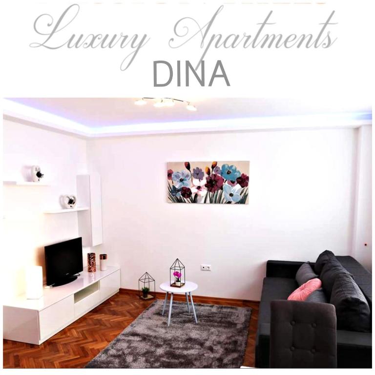 a living room with a couch and a tv at Apartment Dina, Self check in 0-24 in Karlovac