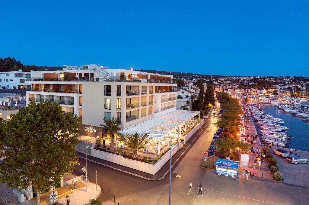 an overhead view of a city street with a building at Luxury Hotel Riva in Malinska