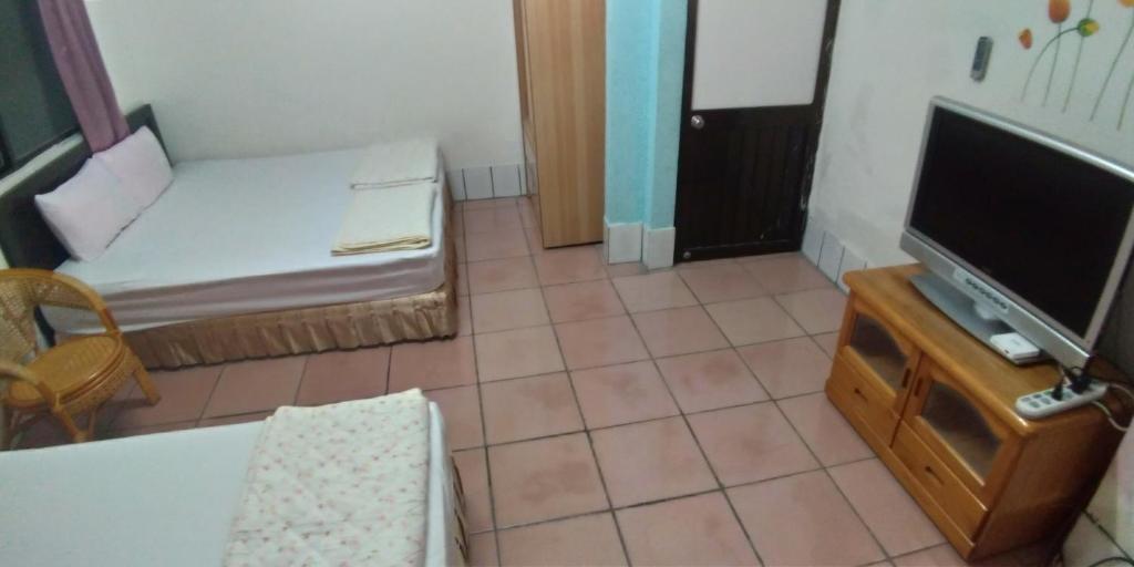 TV a/nebo společenská místnost v ubytování Sun Wu Homestay