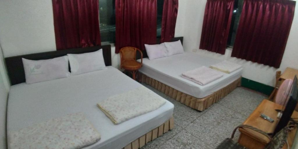 Postel nebo postele na pokoji v ubytování Sun Wu Homestay