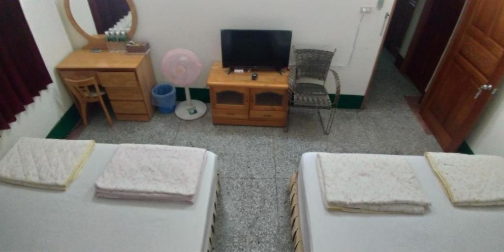 Postel nebo postele na pokoji v ubytování Sun Wu Homestay