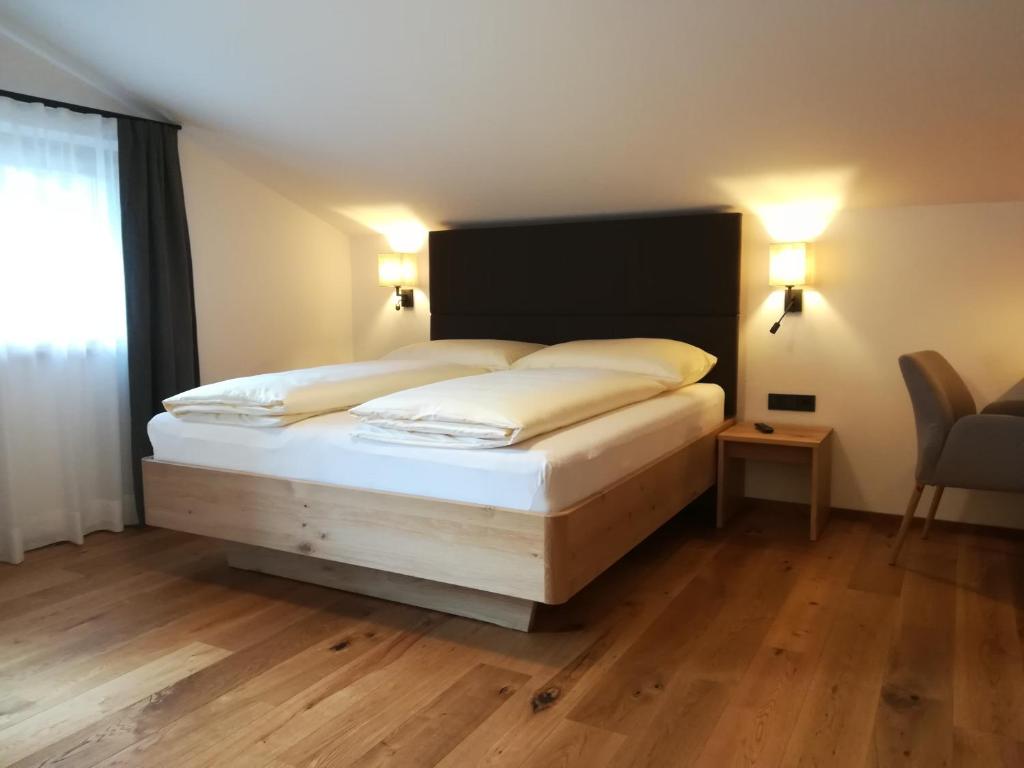 Postel nebo postele na pokoji v ubytování Gästehaus Toferer