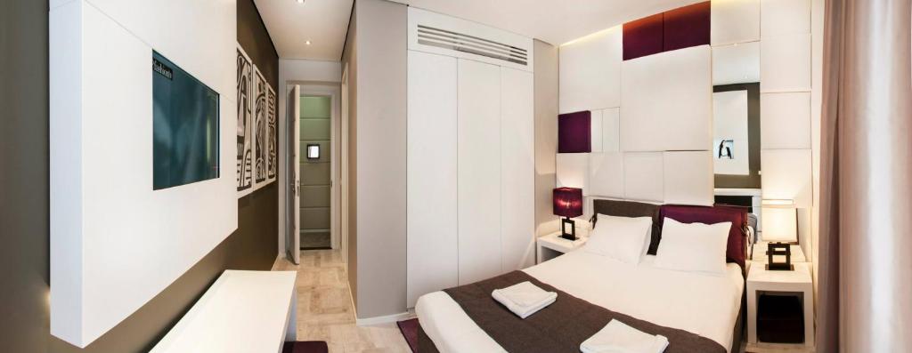 Voodi või voodid majutusasutuse Eden Garden Suites toas