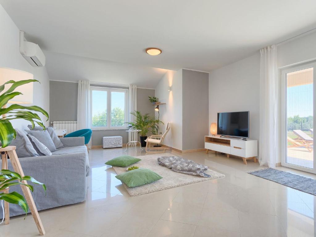 TV a/nebo společenská místnost v ubytování Holiday Home Eugen by Interhome